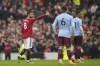 Manchester United's Bruno Fernandes celebrates after scoring his side's opening goal during the English Premier League soccer match between Manchester United and Aston Villa at the Old Trafford stadium in Manchester, England, Sunday, April 30, 2023. (AP Photo/Dave Thompson)