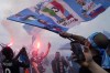 Napoli fans celebrates on the street after their team scored the first goal during the Serie A soccer match between Napoli and Salernitana at the Diego Armando Maradona stadium, in Naples, Italy, Sunday, April 30, 2023. (AP Photo/Gregorio Borgia)