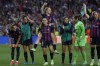 Barcelona's Laia Codina carries teammate Keira Walsh celebrating at the end of the Women's Champions League semifinal, second leg, soccer match between FC Barcelona and Chelsea FC at the Camp Nou stadium in Barcelona, Spain, Thursday, April 27, 2023. The match ended in a 1-1 draw but Barcelona advance on a 2-1 aggregate. At left are Ana-Maria Crnogorcevic and Marta Torrejon and at right is Alexia Putellas. (AP Photo/Joan Monfort)