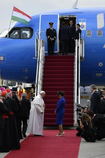 Pope Francis is greeted by Hungary President Katalin Novak during the farewell ceremony at the Budapest International Airport in Budapest, Hungary, Sunday, April 30, 2023. (AP Photo/Denes Erdos)