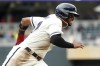 Minnesota Twins' Willi Castro rounds third base en route to scoring against the Kansas City Royals on a Nick Gordon single in the third inning of a baseball game Sunday, April 30, 2023, in Minneapolis. (AP Photo/Bruce Kluckhohn)