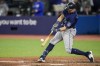 Seattle Mariners catcher Cal Raleigh (29) hits his second home run of the game against the Toronto Blue Jays during tenth inning American League MLB baseball action in Toronto, Sunday, April 30, 2023. THE CANADIAN PRESS/Andrew Lahodynskyj