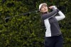 Xiyu Lin watches her shot on the second tee during the final round of the LPGA LA Championship golf tournament at Wilshire Country Club, Sunday, April 30, 2023, in Los Angeles. (AP Photo/Marcio Jose Sanchez)