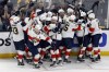 The Florida Panthers celebrate after defeating the Boston Bruins on a goal by Carter Verhaeghe in overtime during Game 7 of an NHL hockey Stanley Cup first-round playoff series, Sunday, April 30, 2023, in Boston. (AP Photo/Michael Dwyer)
