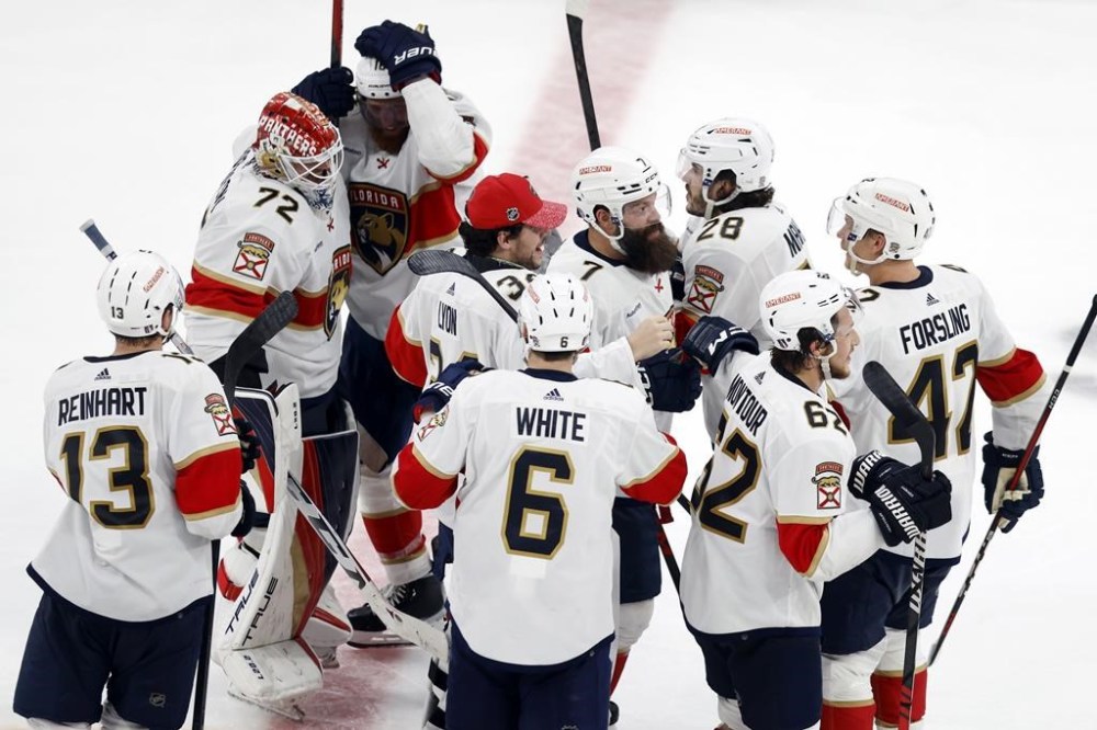 Florida Panthers' Sergei Bobrovsky (72) celebrates with teammates after defeating the Boston Bruins in overtime during Game 7 of an NHL hockey Stanley Cup first-round playoff series, Sunday, April 30, 2023, in Boston. (AP Photo/Michael Dwyer)