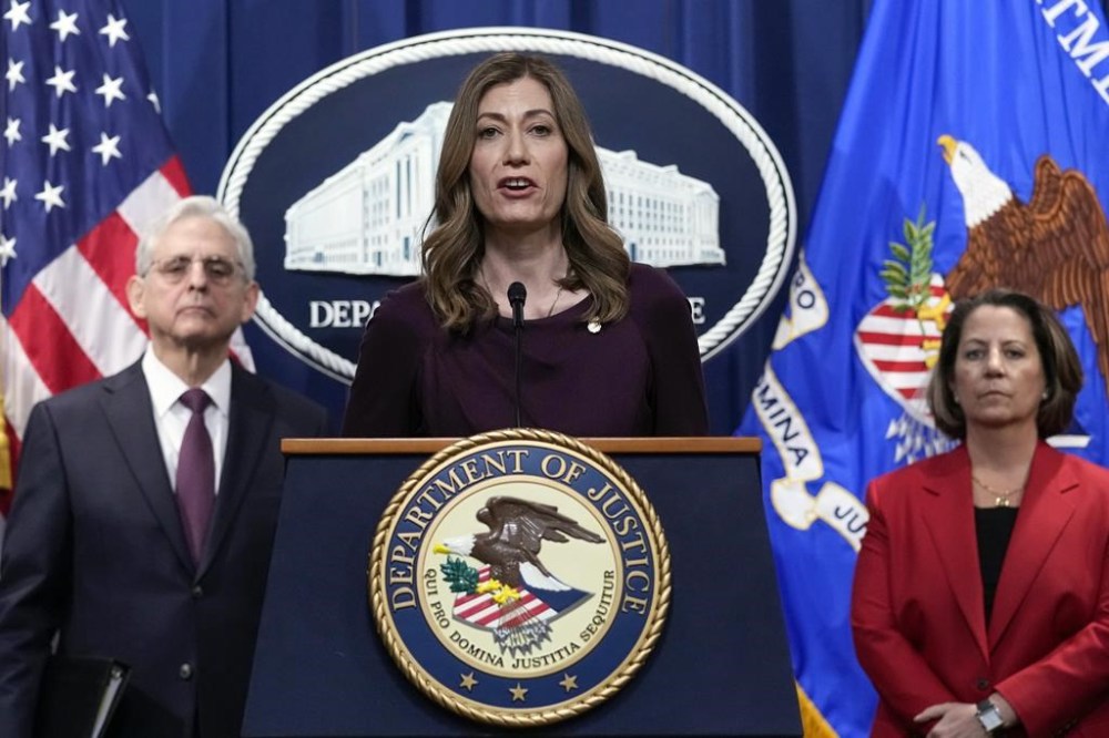 FILE - DEA Administrator Anne Milgram, center, flanked by Attorney General Merrick Garland, left, and Deputy Attorney General Lisa Monaco, right, speaks during a news conference at the Justice Department in Washington, Friday, April 14, 2023. Prosecutors revealed in a recent indictment that while Sinaloa cartel boss Joaquín