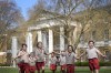 Pupils from Hill House School in London, play on the grass in front of the now Saatchi Gallery, where Britain's King Charles III played sport as a pupil, Thursday, April 20, 2023. King Charles III hasn’t even been crowned yet, but his name is already etched on the walls of Hill House School in London. A wooden slab just inside the front door records Nov. 7, 1956, as the day the future king enrolled at Hill House alongside other notable dates in the school’s 72-year history. (AP Photo/Kirsty Wigglesworth)