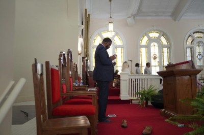 The Rev. M. Andrew Davis, joins his congregants in praise as the choir sings on Sunday, April 16, 2023, at Zion Baptist Church in Columbia, S.C. Despite a drop in in-person church attendance, Davis says that the Black churches remain fundamental to the community by continuing to provide refuge and hope, especially during times of challenge. (AP Photo/Jessie Wardarski)