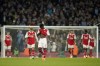 Arsenal's Bukayo Saka, center, reacts after Manchester City's scored their third goal during the English Premier League soccer match between Manchester City and Arsenal at Etihad stadium in Manchester, England, Wednesday, April 26, 2023. (AP Photo/Dave Thompson)