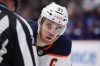 Edmonton Oilers' Connor McDavid lines up for a faceoff against the Vancouver Canucks during the third period of an NHL hockey game in Vancouver, on Tuesday, January 25, 2022. Hockey superstar McDavid and the “Degrassi” franchise are among this year’s inductees to Canada’s Walk of Fame. THE CANADIAN PRESS/Darryl Dyck