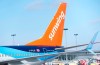 A Sunwing aircraft is parked at Montreal Trudeau airport in Montreal on Wednesday, March 2, 2022. The WestJet Group says it has closed its acquisition of Sunwing Vacations and Sunwing Airlines that was first announced in March last year. THE CANADIAN PRESS/Paul Chiasson