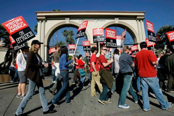 Striking writers walk the picket line in 2007. Television and movie writers on Monday declared that they will launch an industrywide strike. (Nick Ut / The Associated Press files)