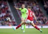 Arsenal's Lina Hurtig, right, and VfL Wolfsburg's Tabea Wassmuth battle for the ball during the Women's Champions League semifinal second leg soccer match between Arsenal and VfL Wolfsburg at the Emirates Stadium, London, Monday May 1, 2023. (Adam Davy/PA via AP)
