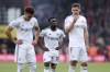 Leeds United's Wilfried Gnonto, center, looks dejected following their defeat in the English Premier League soccer match between Bournemouth and Leeds United at the Vitality Stadium, Bournemouth, England, Sunday April 30, 2023. (Steven Paston/PA via AP)