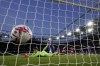 Arsenal's Martin Odegaard scores their sides second goal during a English Premier League soccer match between Arsenal and Chelsea at the Emirates Stadium in London, Tuesday, May 2, 2023. (Adam Davy/PA via AP)
