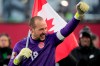 Canada's Milan Borjan (18) celebrates the team's 2-0 victory following second half World Cup qualifying soccer action against the United States, in Hamilton, Ont., Sunday, Jan. 30, 2022. Goalkeeper Borjan and forward Cloé Lacasse have been named Canada Soccer’s Players of the Month for April.THE CANADIAN PRESS/Frank Gunn