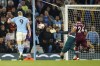 Manchester City's Erling Haaland, left, scores his side's second goal during the English Premier League soccer match between Manchester City and West Ham United at Etihad stadium in Manchester, England, Wednesday, May 3, 2023. (AP Photo/Dave Thompson)