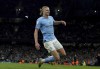 Manchester City's Erling Haaland celebrates after scoring his side's second goal during the English Premier League soccer match between Manchester City and West Ham United at Etihad stadium in Manchester, England, Wednesday, May 3, 2023. (Martin Rickett/PA via AP)