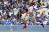 Philadelphia Phillies' Bryce Harper heads to second for a double during the third inning of a baseball game against the Los Angeles Dodgers Wednesday, May 3, 2023, in Los Angeles. (AP Photo/Mark J. Terrill)