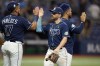 Tampa Bay Rays' Brandon Lowe, center, celebrates with Harold Ramirez, right, and Isaac Paredes, left, after the team defeated the Pittsburgh Pirates during a baseball game Wednesday, May 3, 2023, in St. Petersburg, Fla. (AP Photo/Chris O'Meara)