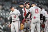 Minnesota Twins manager Rocco Baldelli, second from left, pulls starting pitcher Louie Varland (37) during the fifth inning of a baseball game against the Chicago White Sox on Wednesday, May 3, 2023, in Chicago. (AP Photo/Charles Rex Arbogast)
