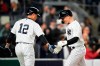 New York Yankees' Jake Bauers, right, celebrates with teammate Isiah Kiner-Falefa after hitting a home run during the fifth inning of a baseball game against the Cleveland Guardians, Wednesday, May 3, 2023, in New York. (AP Photo/Frank Franklin II)
