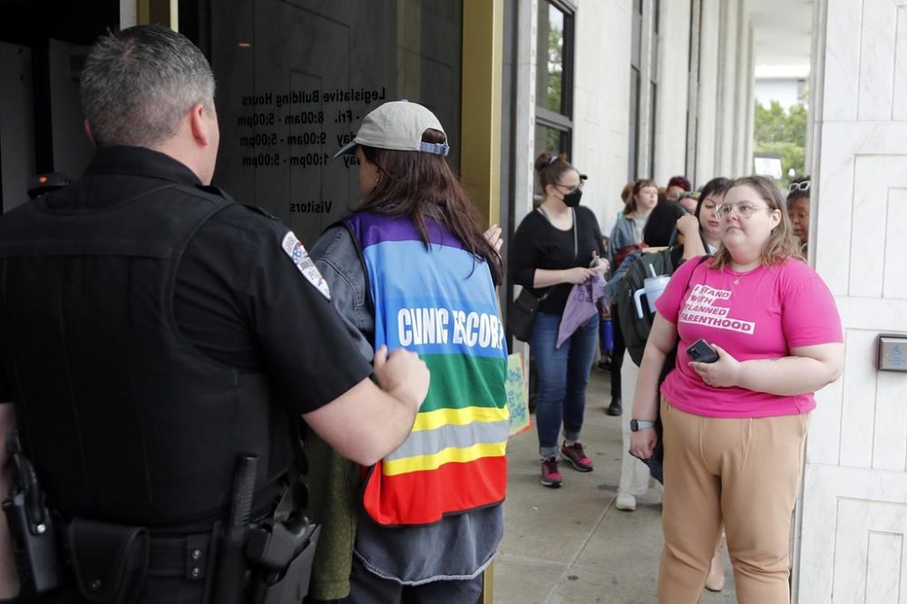 Abortion rights supporters gather enter the general assembly following a rally at Bicentennial Plaza put on by Planned Parenthood South Atlantic in response to a bill before the North Carolina Legislature, Wednesday, May 3, 2023, in Raleigh, N.C. (AP Photo/Karl B DeBlaker)