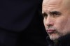 Manchester City's head coach Pep Guardiola watches his players just before the start of the English Premier League soccer match between Fulham and Manchester City at Craven Cottage in London, Sunday, April 30, 2023. City won the game 2-1. (AP Photo/Kin Cheung)