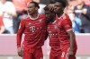 Bayern's Kingsley Coman, second right, celebrates with team mates Bayern's Leroy Sane, left and Bayern's Ryan Gravenberch after scoring his side's second goal during the German Bundesliga soccer match between FC Bayern Munich and Hertha BSC Berlin at the Allianz Arena stadium in Munich, Germany, April 30, 2023. (AP Photo/Matthias Schrader)