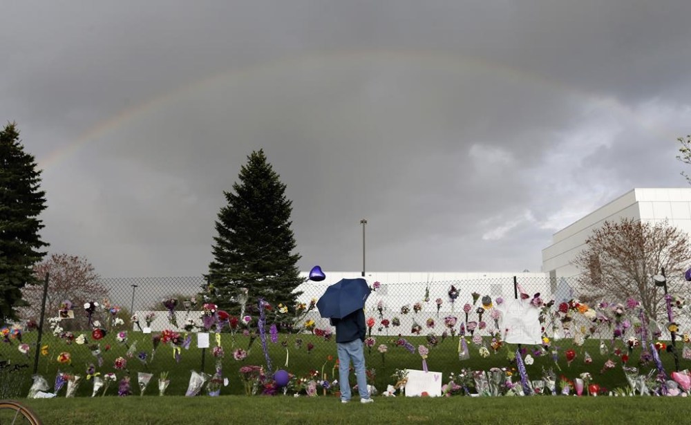FILE - A rainbow appears over Prince's Paisley Park estate near a memorial for the rock superstar in Chanhassen, Minn., April 21, 2016. The late pop superstar Prince will have a highway named after him, thanks to Minnesota lawmakers who voted Thursday, May 4, 2023, to dedicate the highway that runs past his Paisley Park museum and studios to the creator of hits including