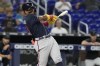 Atlanta Braves Ronald Acuna Jr. (13) hits a single to center field during the second inning of a baseball game against the Miami Marlins, Thursday, May 4, 2023, in Miami. (AP Photo/Marta Lavandier)