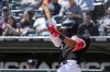 Chicago White Sox's Eloy Jimenez hits a single during the first inning of a baseball game against the Minnesota Twins in Chicago, Thursday, May 4, 2023. (AP Photo/Nam Y. Huh)