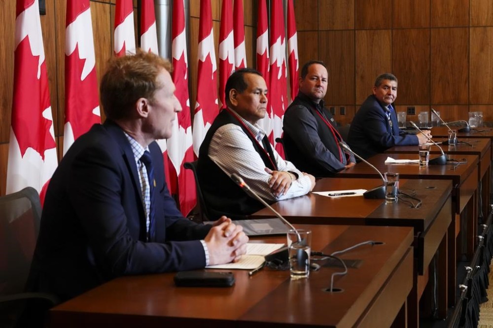 Minister of Crown-Indigenous Relations Marc Miller, left to right, joins Chiefs of the First Nations forming the Regroupement Petapan, Real Tettaut (Nutashkuan), Martin Dufour (Essipit), and Gilbert Dominique (Mashteuiatsh) during a press conference in Ottawa on Thursday, May 4, 2023, regarding the Petapan Treaty project. THE CANADIAN PRESS/Sean Kilpatrick