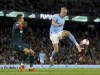 West Ham United goalkeeper Lukasz Fabianski, left, and Manchester City's Erling Haaland in action during the English Premier League soccer match between Manchester City and West Ham United at Etihad stadium in Manchester, England, Wednesday, May 3, 2023. (Martin Rickett/PA via AP)