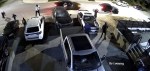 A large group of armed suspects using various weapons, including axes, swords, and baseball bats, smash out windows and destroy property in a still from video footage taken in Abbotsford, B.C., on Saturday, April 29, 2023. THE CANADIAN PRESS/HO-Abottsford Police Department *MANDATORY CREDIT*