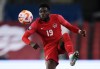 Canada midfielder Alphonso Davies (19) controls the ball against Honduras during first half CONCACAF Nations League soccer action in Toronto on Tuesday, March 28, 2023.&nbsp;Davies has been named the CONCACAF Men’s Player of the Year for the second year in a row. THE CANADIAN PRESS/Nathan Denette