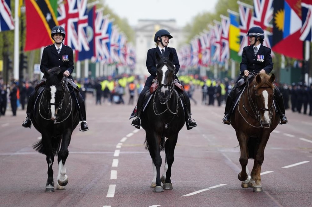 Police ride on horsebacks at the Mall before coronation of Britain's King Charles III in London Saturday, May 6, 2023. (AP Photo/Jon Super, Pool)