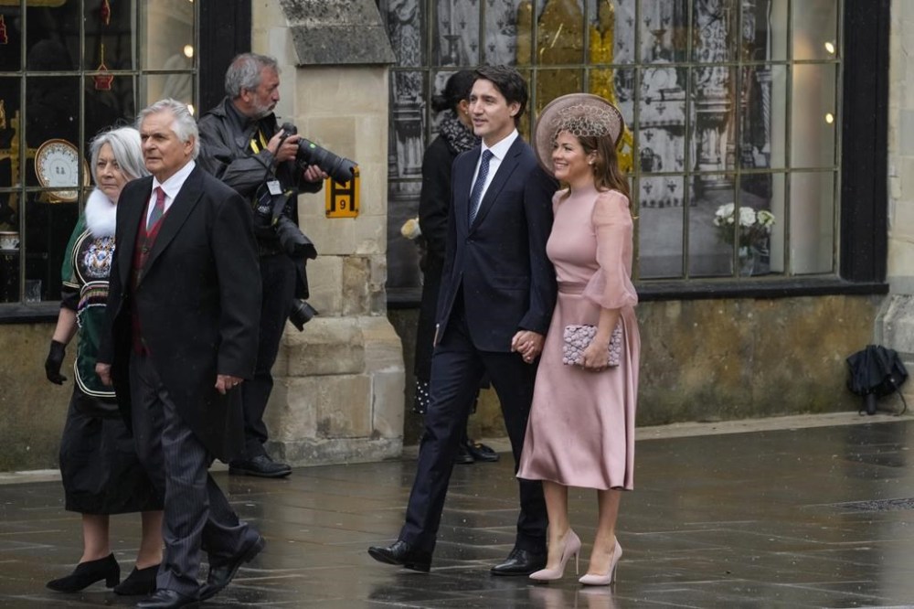 Canadian Prime Minister Justin Trudeau, center left, and Sophie Trudeau arrive at Westminster Abbey prior to the coronation ceremony of Britain's King Charles III in London Saturday, May 6, 2023. (AP Photo/Alessandra Tarantino)