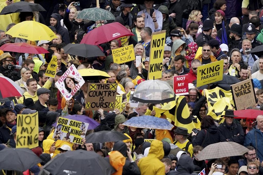 Protesters near Trafalgar Square ahead of the coronation ceremony of King Charles III at Westminster Abbey, London, Saturday May 6, 2023. (Gareth Fuller/Pool Photo via AP)