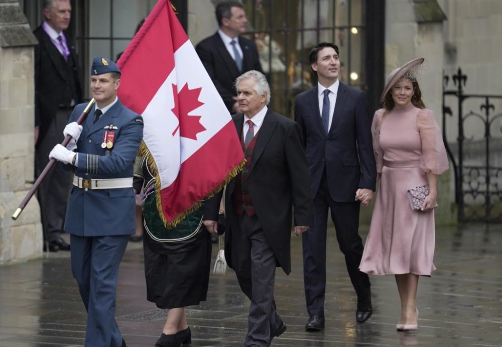 Canadian Prime Minister Justin Trudeau and Sophie Trudeau arrive at Westminster Abbey prior to the coronation ceremony of Britain's King Charles III in London Saturday, May 6, 2023. (AP Photo/Kin Cheung)