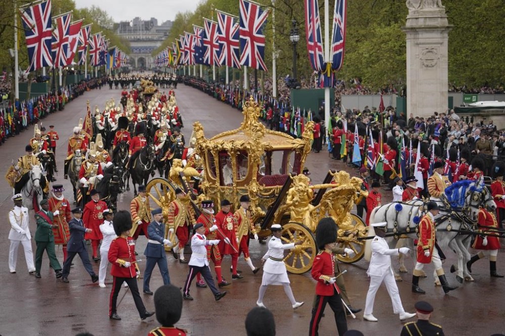 Britain's King Charles III and Queen Camilla are on the way back to Buckingham Palace after his coronation ceremony in London, Saturday, May 6, 2023. (AP Photo/Vadim Ghirda)