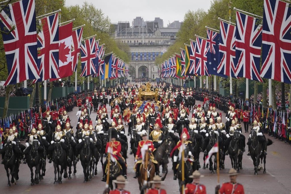The procession is on the way to Buckingham Palace after coronation ceremony for Britain's King Charles III and Queen Camilla in London, Saturday, May 6, 2023. (AP Photo/Vadim Ghirda)