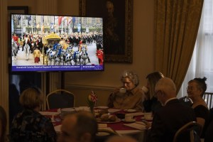 People attend an early morning viewing party of the coronation of King Charles III at Government House in Halifax on Saturday, May 6, 2023. THE CANADIAN PRESS/Darren Calabrese