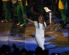 Olympian Charmaine Crooks carries the Pan Am flame during the opening ceremony of the 2015 Pan Am Games in Toronto, Friday, July 10, 2015.&nbsp;Crooks has been elected president of Canada Soccer.&nbsp;THE CANADIAN PRESS/AP-Julio Cortez