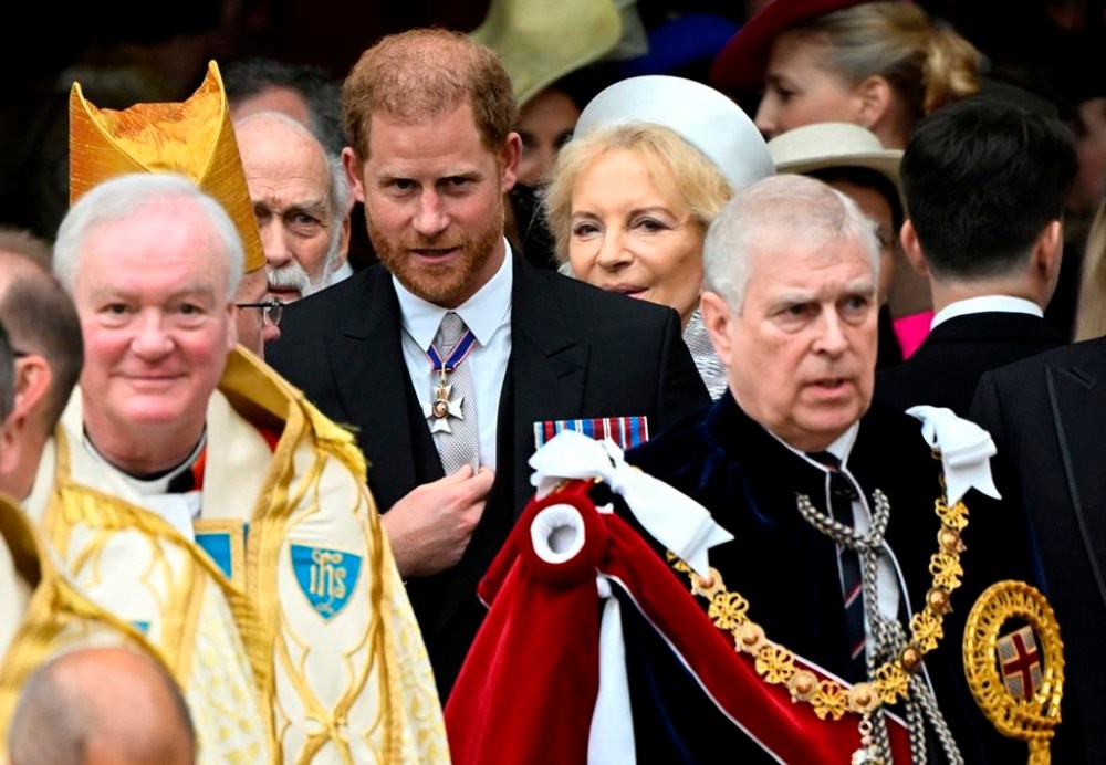Britain's Prince Harry, Duke of Sussex, and Prince Andrew leave Westminster Abbey following the coronation ceremony of Britain's King Charles and Queen Camilla, in London, Saturday, May 6, 2023. (Toby Melville, Pool via AP)