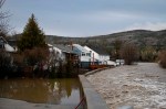 Houses are flooded near the Bras-du-Nord river Monday, May 1, 2023 in downtown Baie-Saint-Paul, Quebec. Quebec public security officials say 89 municipalities are dealing with spring flooding with more than 660 people across the province forced to leave their homes. THE CANADIAN PRESS/Jacques Boissinot