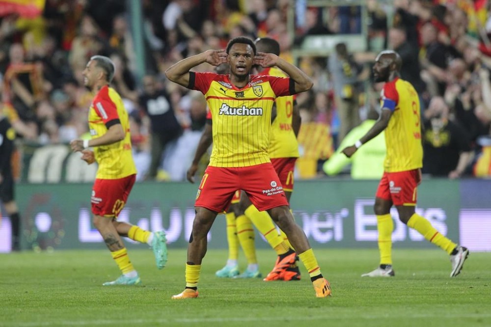 Lens' Lois Openda reacts after scoring during a French League One soccer match between Lens and Marseille at the Bollaert stadium in Lens, France, Saturday, May 6, 2023. (AP Photo/Michel Spingler)