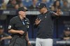 New York Yankees manager Aaron Boone talks to home plate umpire Lance Barksdale during the sixth inning of a baseball game against the Tampa Bay Rays Saturday, May 6, 2023, in St. Petersburg, Fla. (AP Photo/Chris O'Meara)