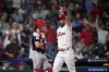Philadelphia Phillies' Bryce Harper, right, reacts after hitting a home run against Boston Red Sox pitcher Corey Kluber during the fifth inning of a baseball game, Saturday, May 6, 2023, in Philadelphia. (AP Photo/Matt Slocum)