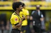 Dortmund's Karim Adeyemi reacts after missing a penalty kick during the German Bundesliga soccer match between Borussia Dortmund and VfL Wolfsburg in Dortmund, Germany, Saturday, May 7, 2023. (AP Photo/Martin Meissner)
